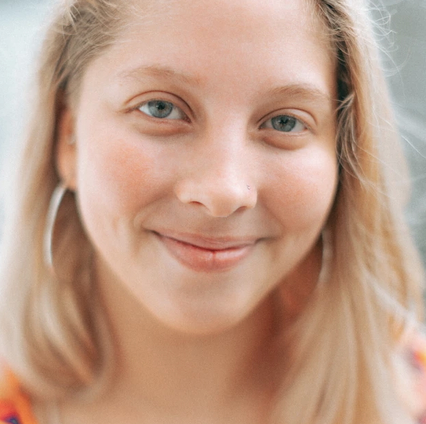 White woman smiling no makeup